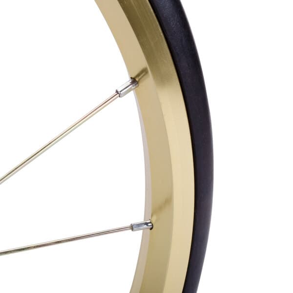 A close-up of a white Carnival King 16" wheel with a black rim.