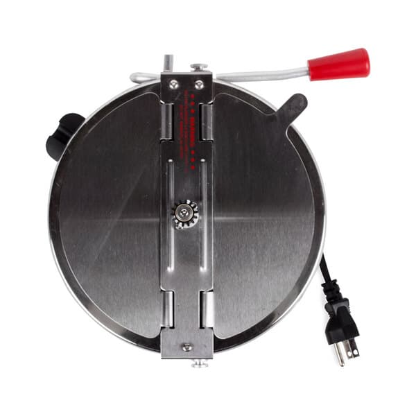 A metal circular kettle with a red handle.