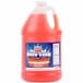 A large plastic jug of Carnival King orange snow cone syrup with a white label.