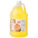 A jug of yellow Carnival King Pina Colada slushy syrup with a lid.