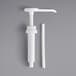 A white plastic pump with a white tube and cap.