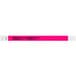 A neon pink Carnival King wristband with the words "OVER 21" in white.