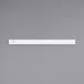 A white rectangular Carnival King wristband on a gray surface.