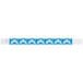 A blue and white Carnival King wristband with white arrow designs.
