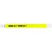 A yellow Carnival King wristband with the words "OVER 21" in white.