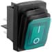 A close up of a green and black Carnival King rocker switch.
