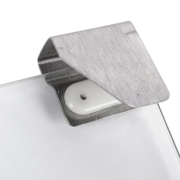 Replacement doors for a Carnival King popcorn machine with a white plastic holder and a metal clip.