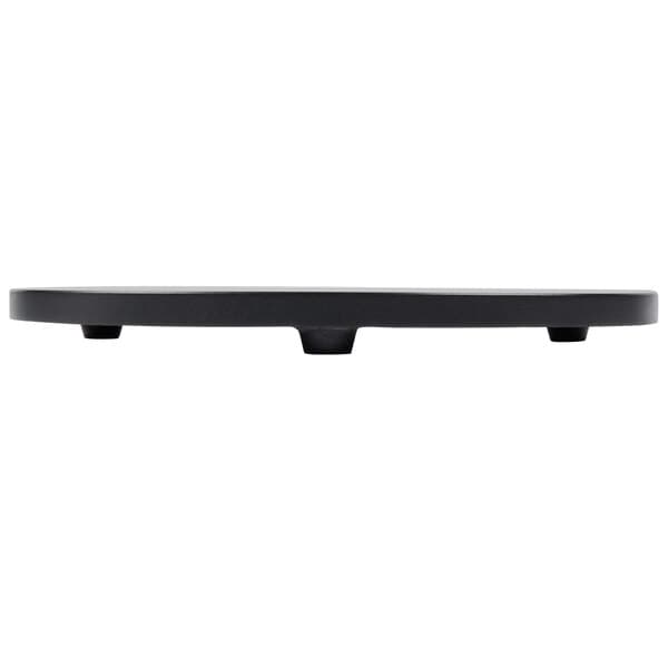 A black oval Carnival King hot plate on a table.