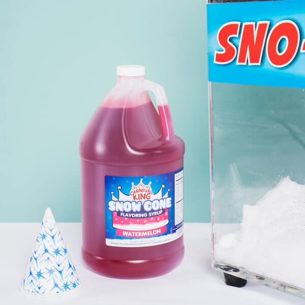 A plastic jug of red Carnival King watermelon snow cone syrup.