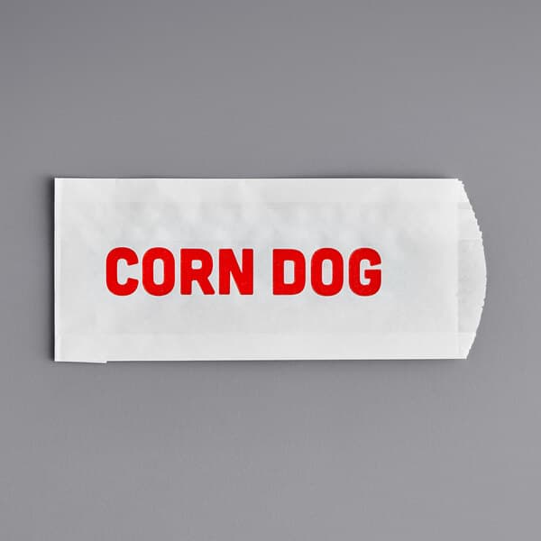 A white paper bag with red text that reads "Carnival King"