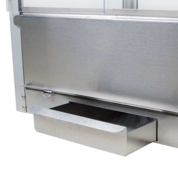 A metal crumb tray with a drawer for a Carnival King popcorn machine.