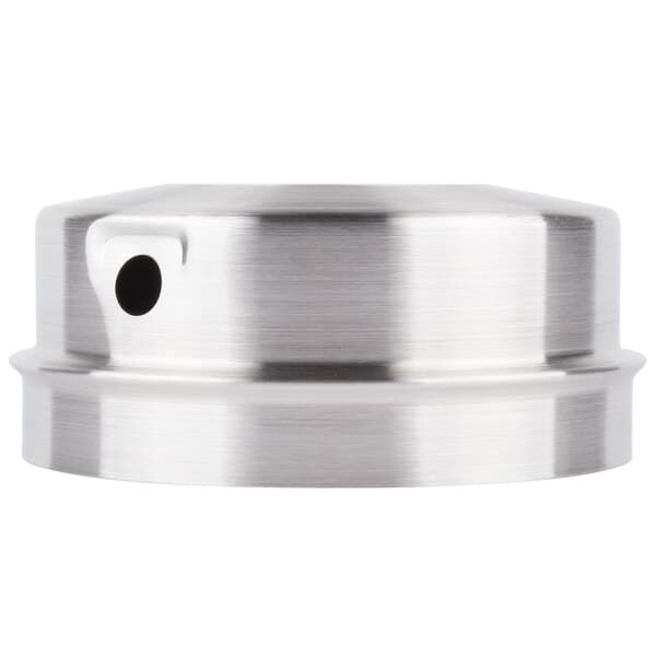 A stainless steel metal cap with a hole in the center.