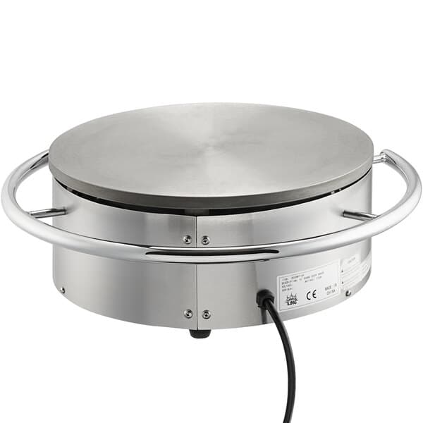 A round metal Carnival King crepe maker with a black cord.