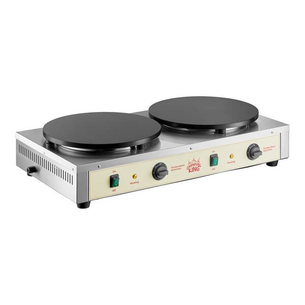 A dual non-stick electric crepe maker with two round cooking surfaces and control knobs.