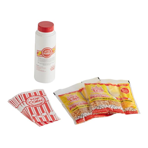 A white bottle of popcorn seasoning and several packages of popcorn on a white background.