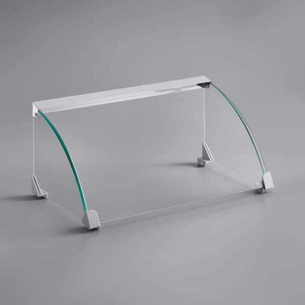 A clear glass sneeze guard with a metal frame for a Carnival King HDRG18 roller grill.