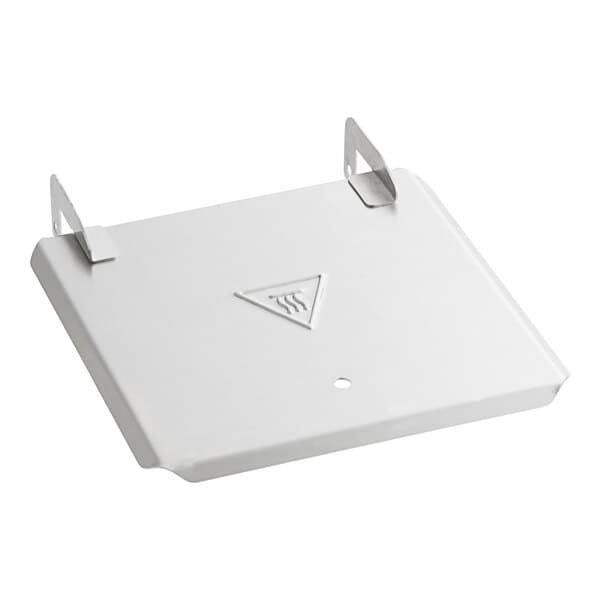 A white metal cover with a triangle on it.