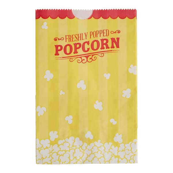 A yellow paper bag with white and red text reading "Popcorn" and "Fresh" on it.