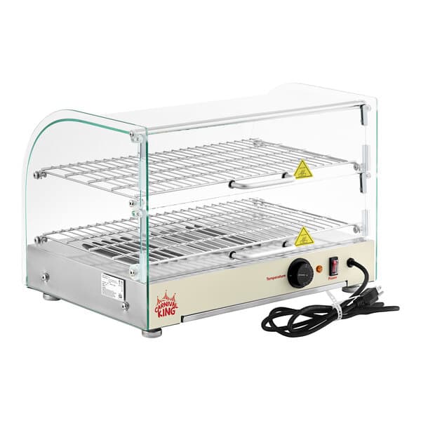 A Carnival King curved glass countertop food warmer with wire shelves.