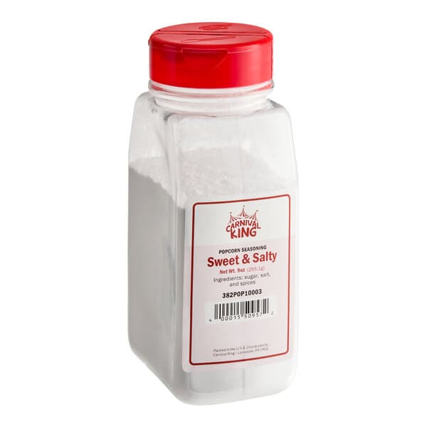 A plastic container of Carnival King Sweet and Salty Popcorn Seasoning with a red lid.