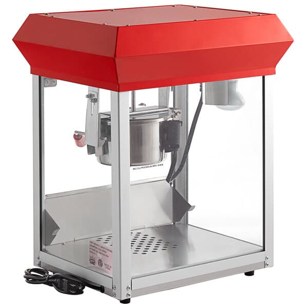 A red and white Carnival King commercial popcorn machine with a red lid.